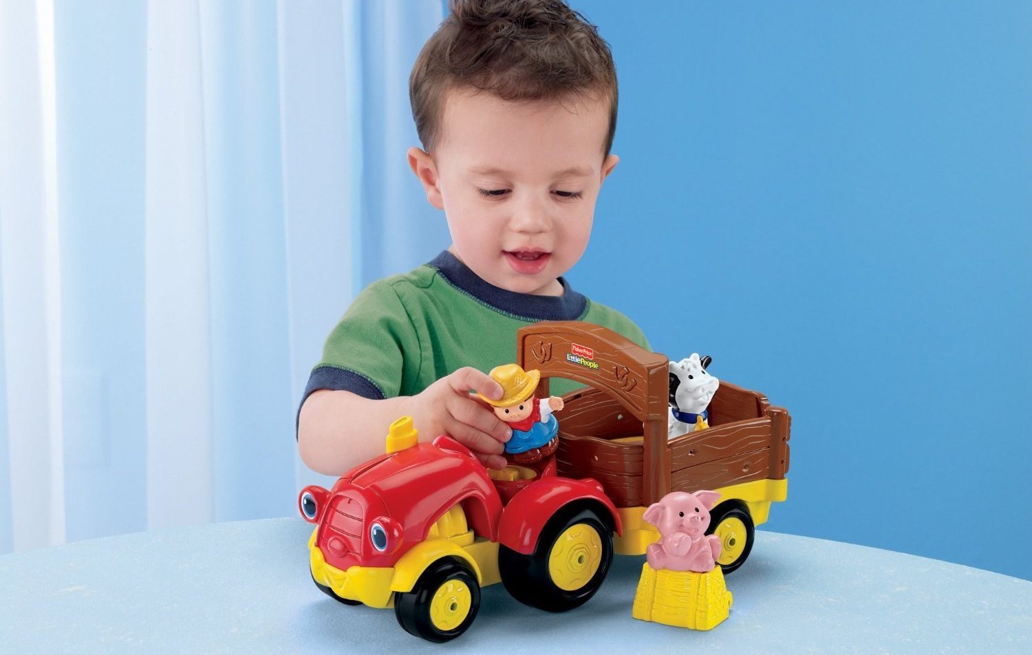 AMAZON PRIME: Fisher-Price Little People Tow ‘n Pull Tractor Only $9.84!